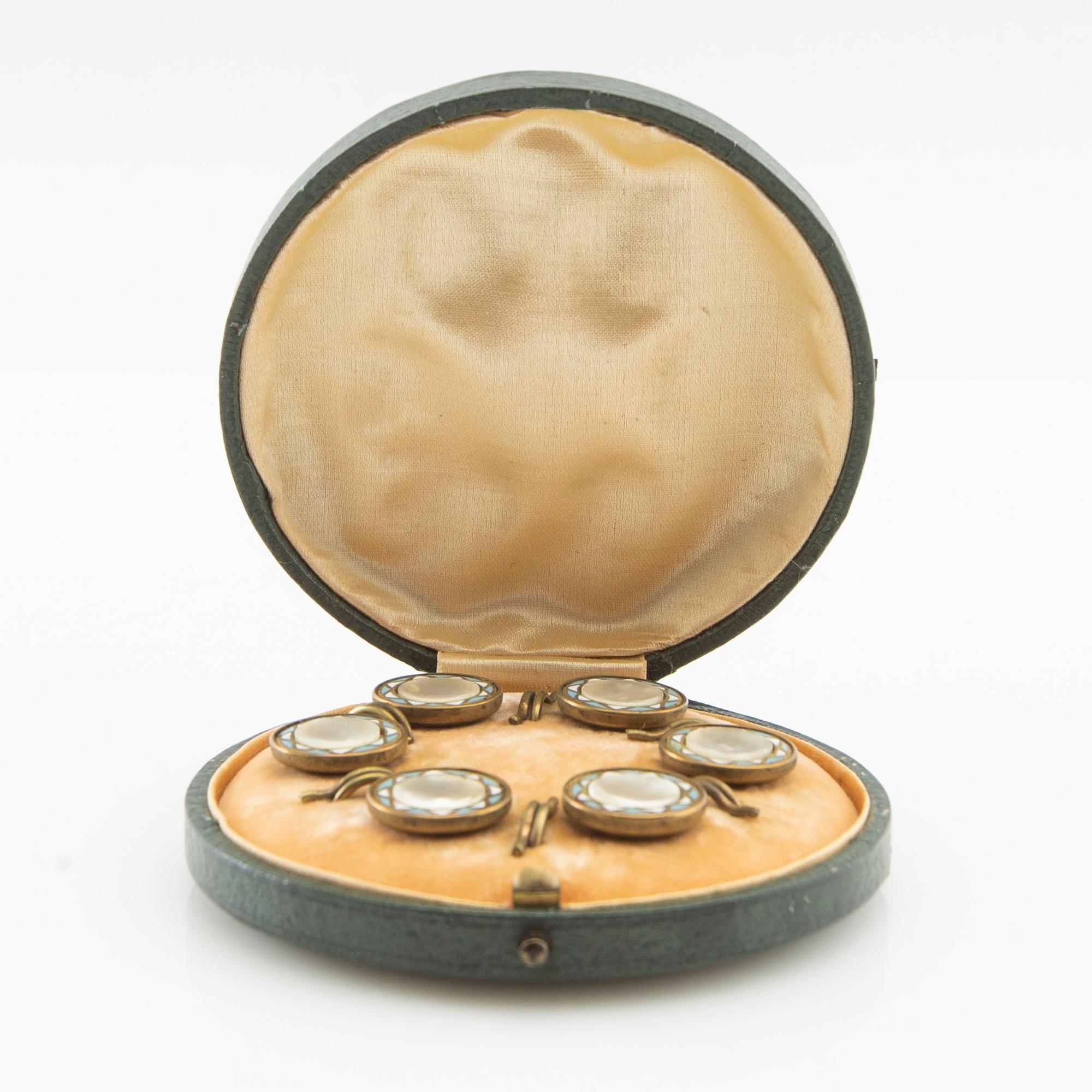 Shirt buttons made of brass with decoration of enamel and mother-of-pearl, early 20th century.
