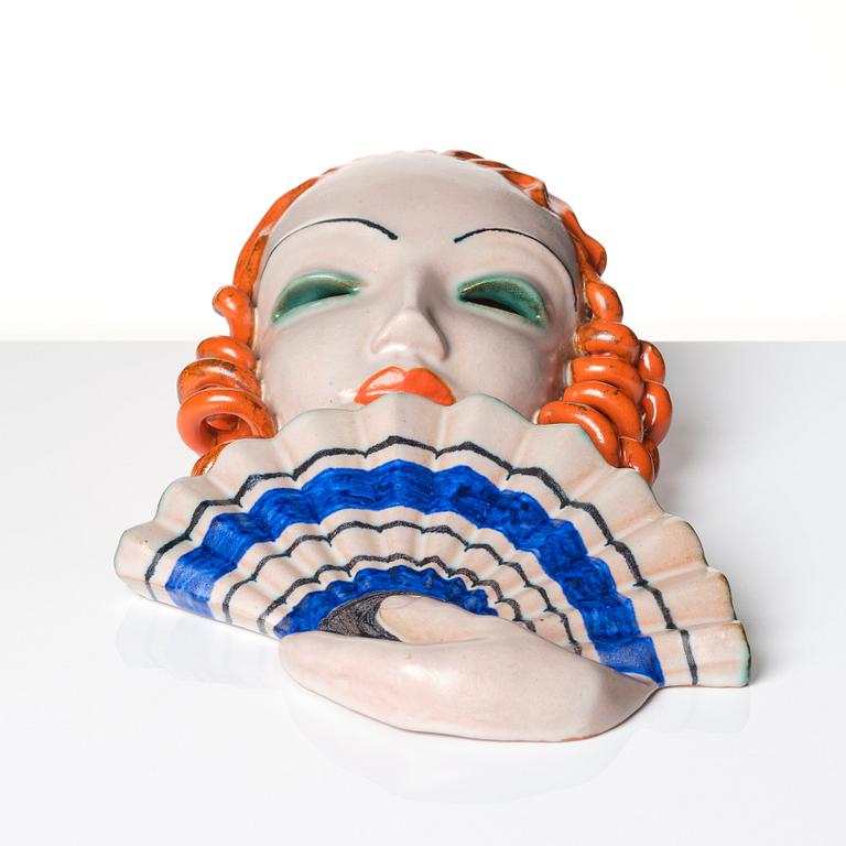 Rudolf Knörlein, an earthenware wall mask, Goldscheider, Vienna, 1930s, model 6542.