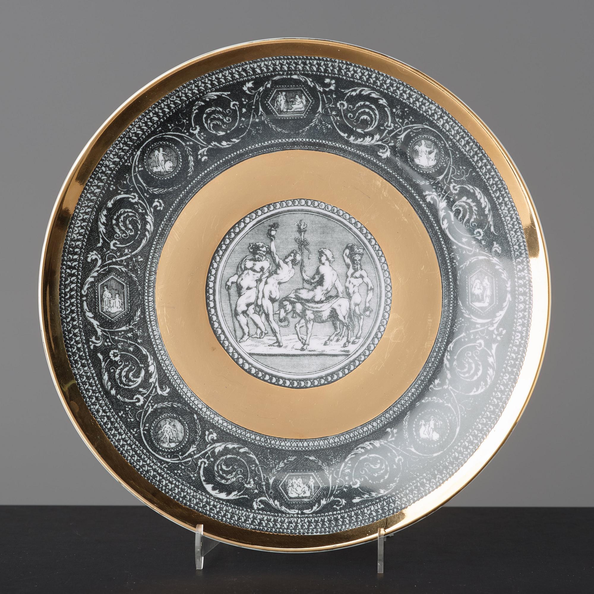 Piero Fornasetti, a set of six "Cammei" porcelain plates, Milano, Italy.