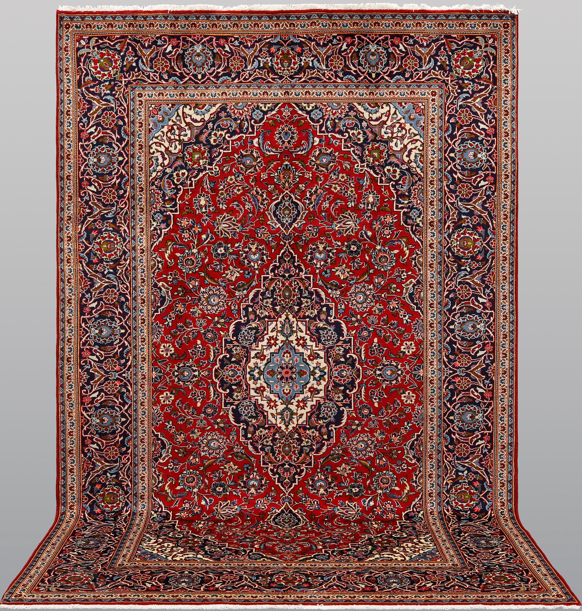 A Keshan rug, approx. 307 x 195 cm.
