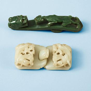 1634. Two Chinese carved nephrite belt buckles.