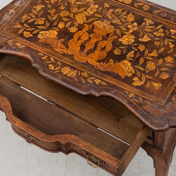 A Dutch 18th century Rococo chest of drawers.