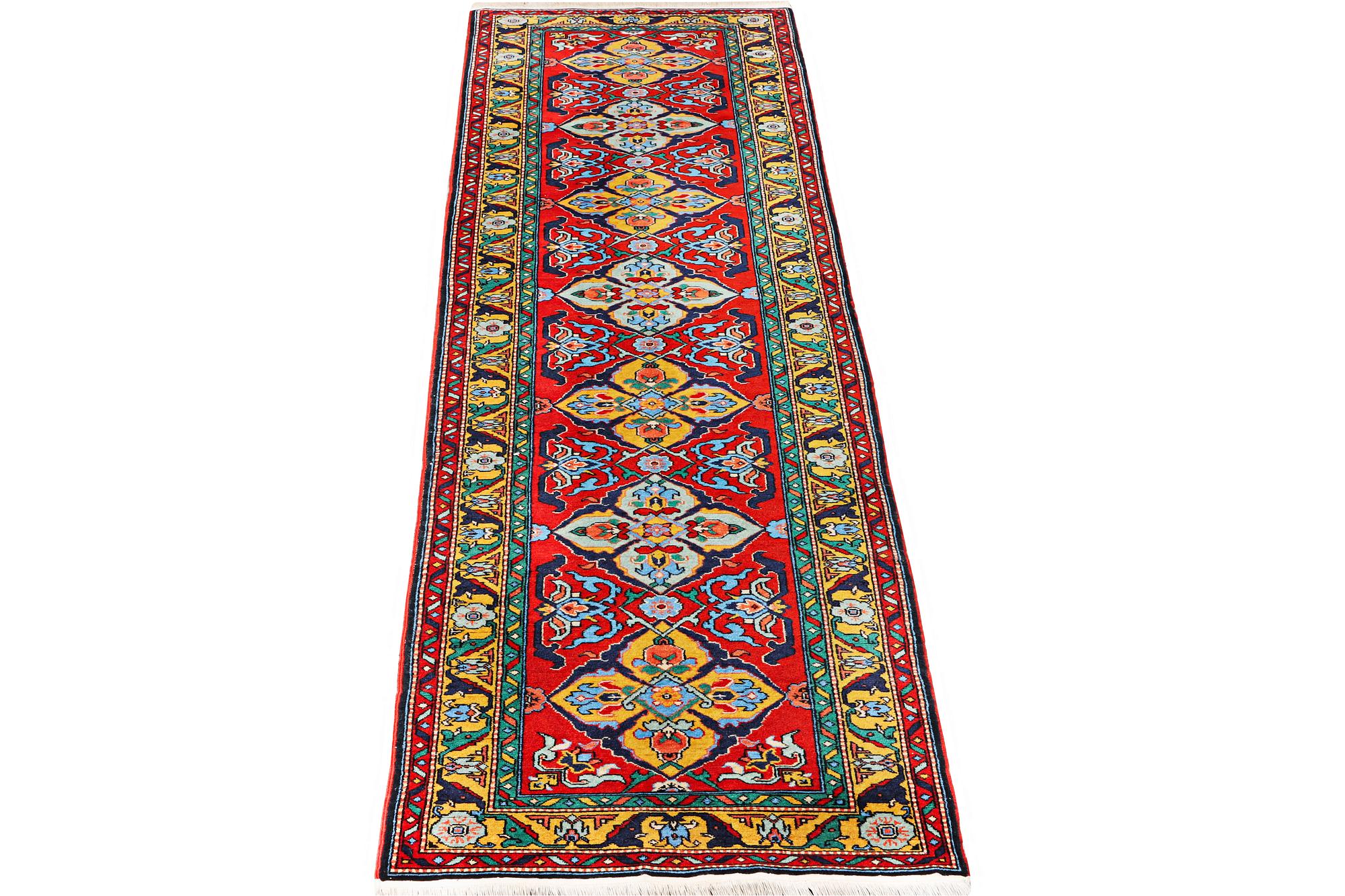 A Kazak runner carpet, c. 344 x 83 cm.