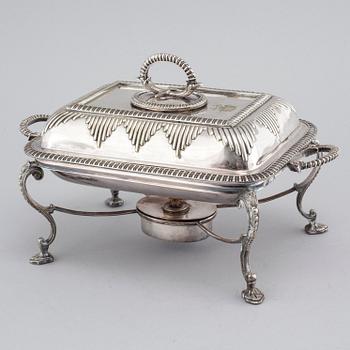 A silvered metal serving dish with rechaud, first half of the 20th century.