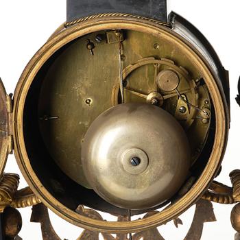 A marble and ormolu Louis XVI portico mantel clock, Paris, late 19th century.