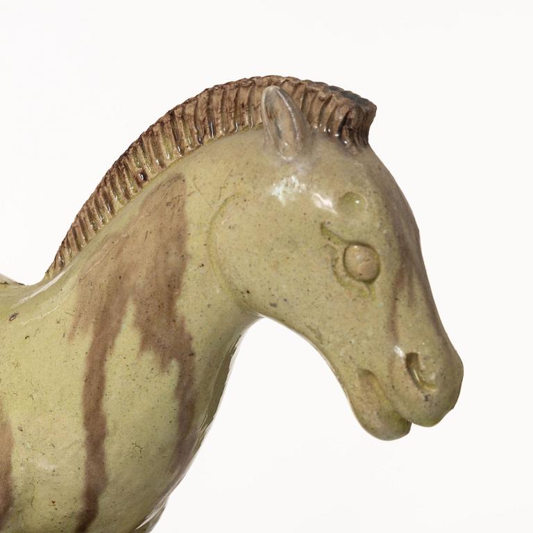 A set of two green and yellow glazed roof tiles figures of flying horses, Qing dynasty.