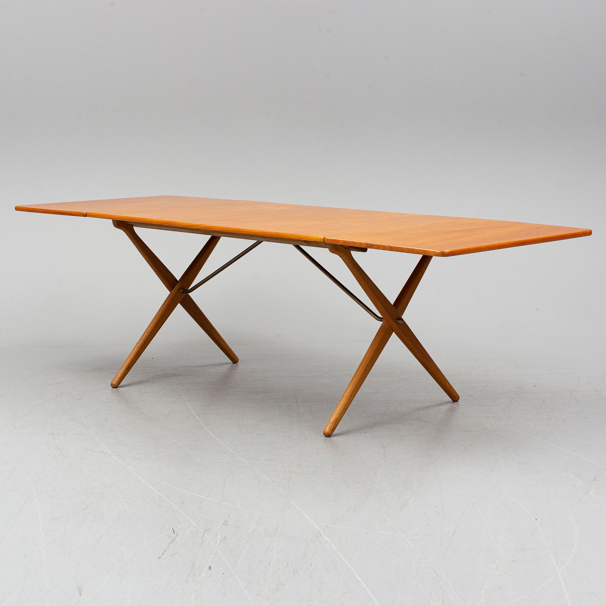 HANS J WEGNER, a teak and oak drop-leaf dining table, Andreas Tuck, Denmark 1950'-60's.