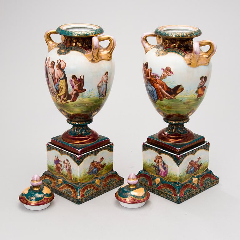 Two similar porcelain urns from around year 1900.