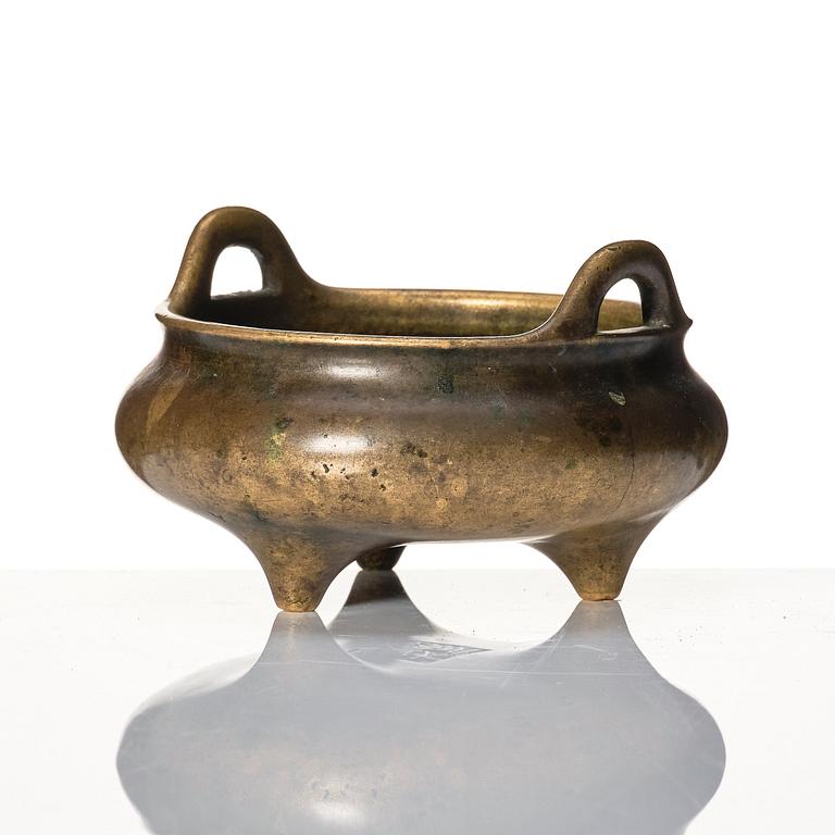 A tripod bronze censer, 17/18th Century with Xuande mark.