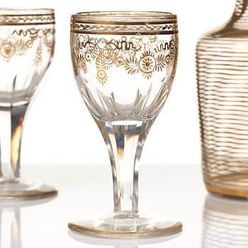 A set of six Russian glass goblets and a bottle with stopper, 19th Century.