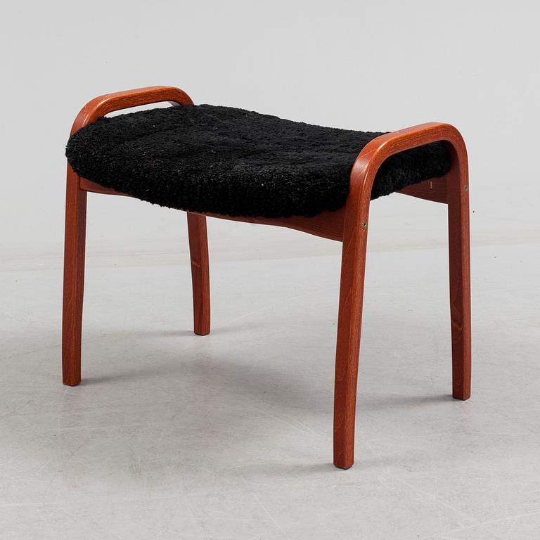 A 'Lamino' foot stool by Yngve Ekström, Swedese.