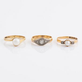 Three pearl and diamond rings.
