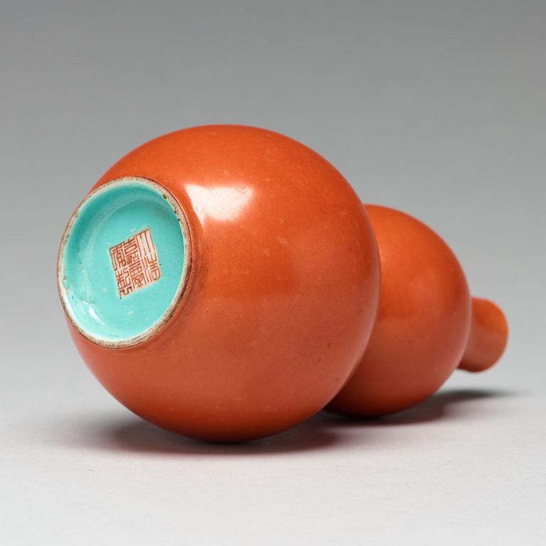 A coral red calebass shaped vase, Qing dynasty with Jiaqing mark (1796-1820).