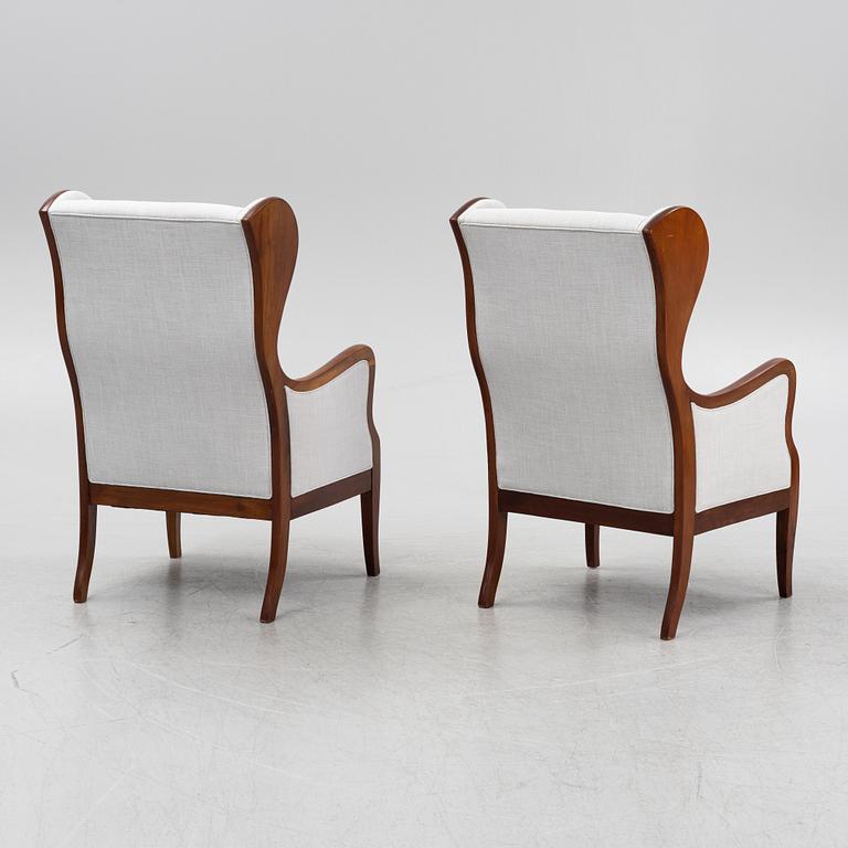 Frits Henningsen, attributed, a pair of wing back easy chairs, Denmark.