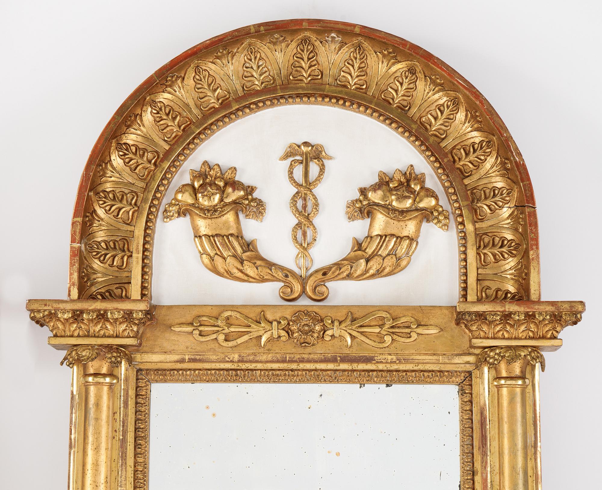 An Swedish Empire mirror, first half of the 19th century, attributed to Petter Gustaf Bylander, (Gothenburg 1802-59).