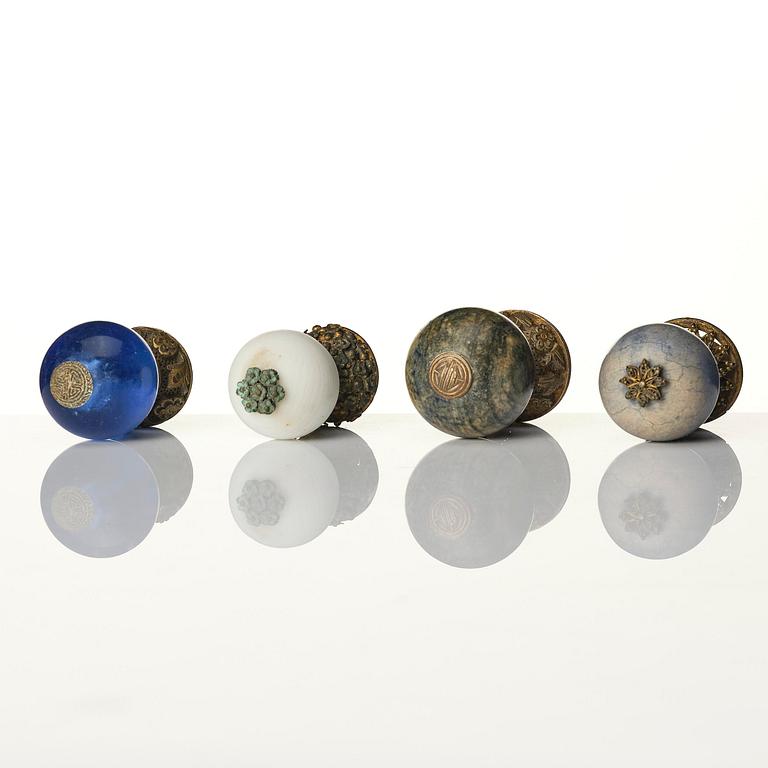 A group of 11 various 'official's hat' finials, Qing dynasty, 19th century.