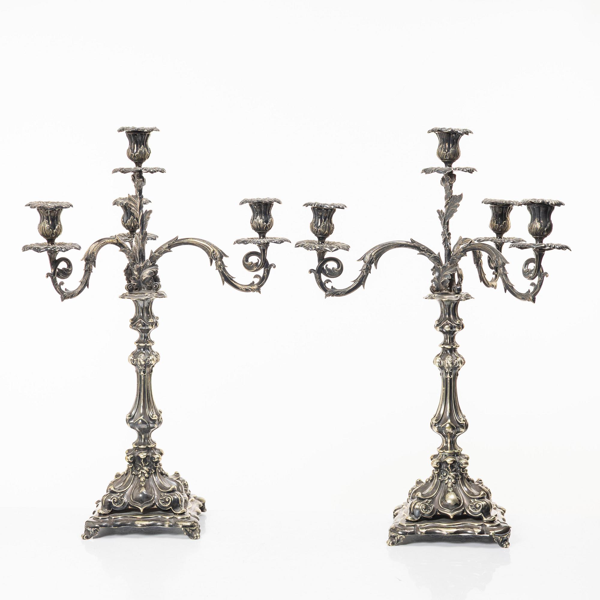 A pair of silver plated Rococo style candelabra, 20th century.