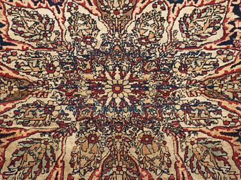 A carpet, an antique Kerman Laver, ca 677-688,5 x 510,5-526 cm.