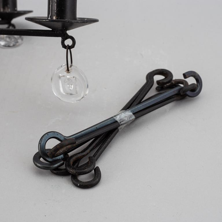 ERIK HÖGLUND, a cast iron and glass chandelier, Boda Smide.