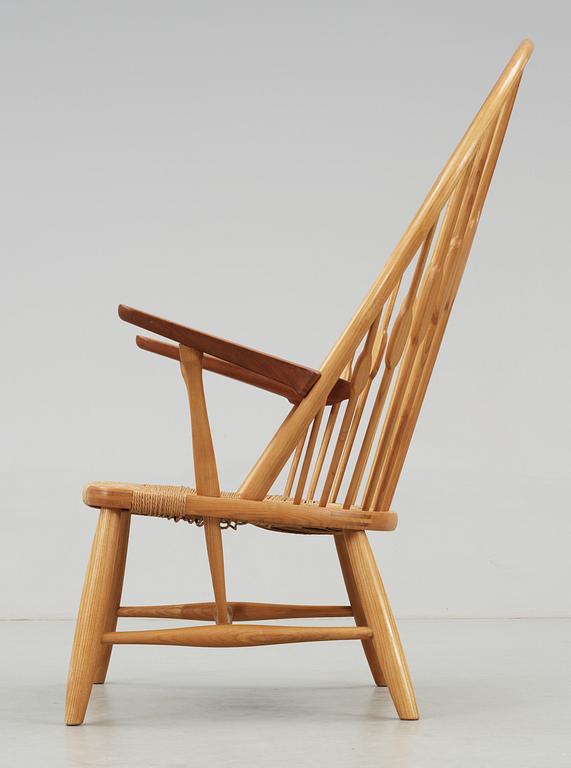 A Hans J Wegner ash and teak 'Peacock chair', Johannes Hansen, Denmark.