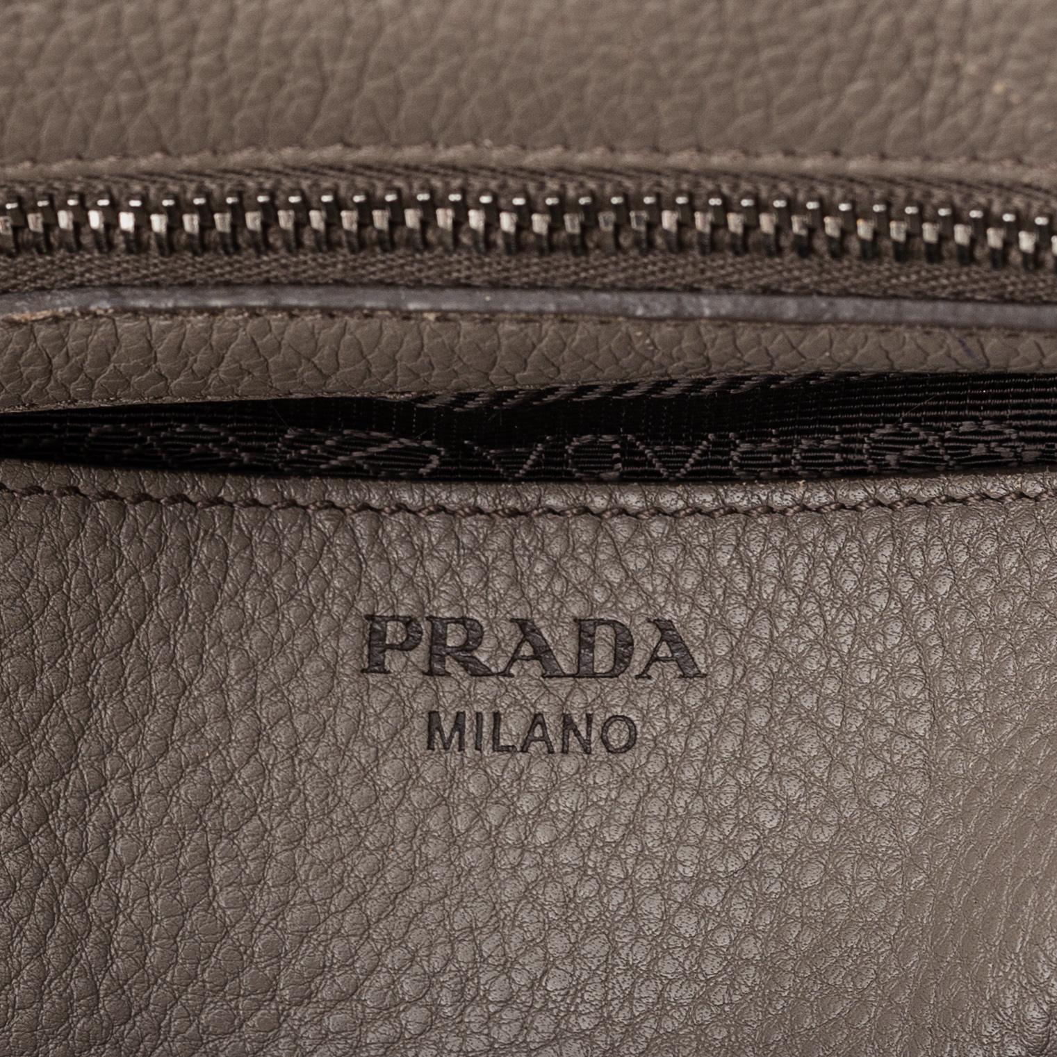 Prada, a leather handbag.
