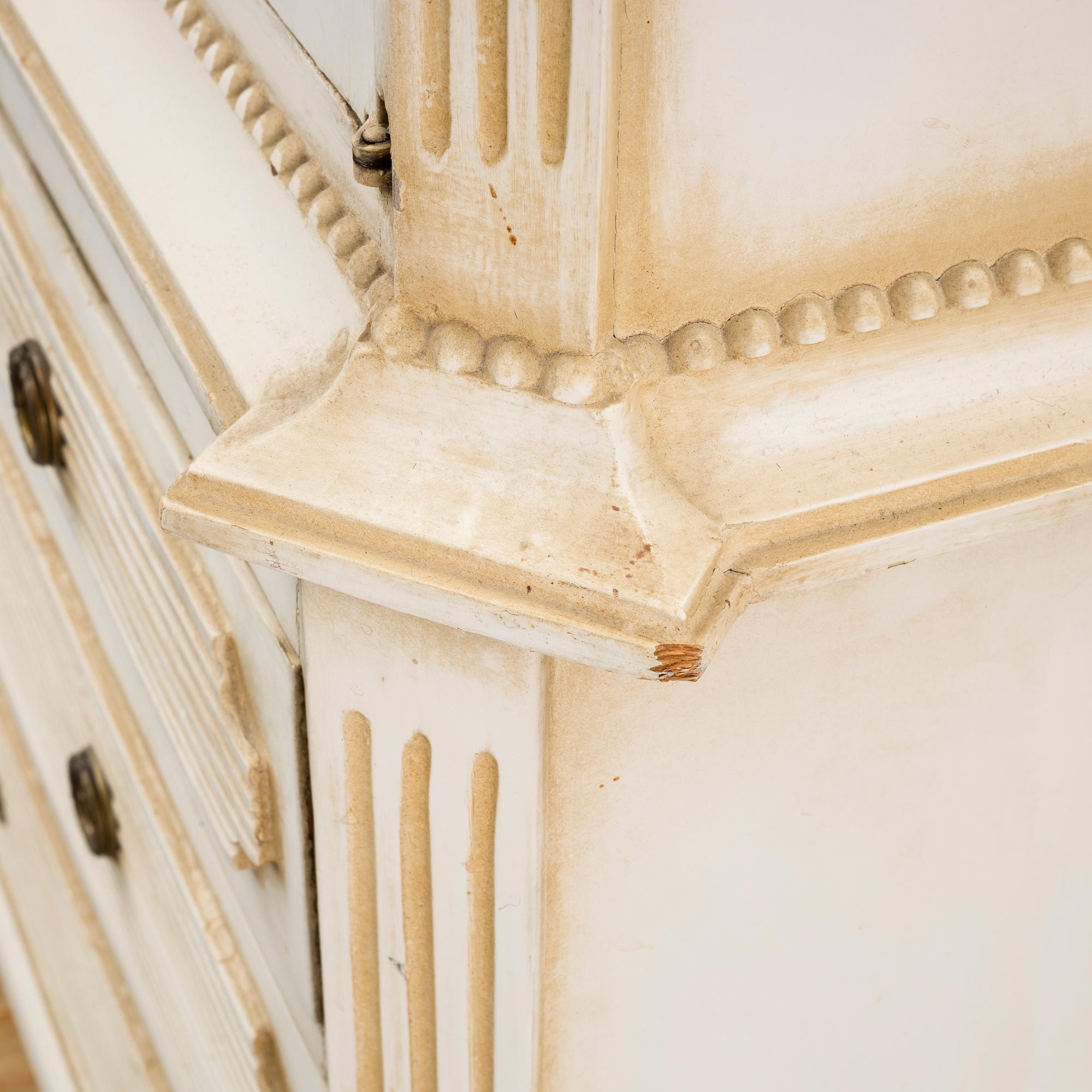A gustavian style cabinet, circa 1900.