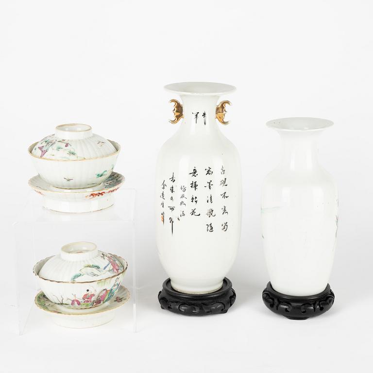 A set of two Chinese famille rose vases and two cups with covers and stands, late Qing dynasty/early 20th Century.