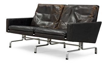 A Poul Kjaerholm 'PK-31-2' steel and black leather sofa, E Kold Christensen, Denmark.