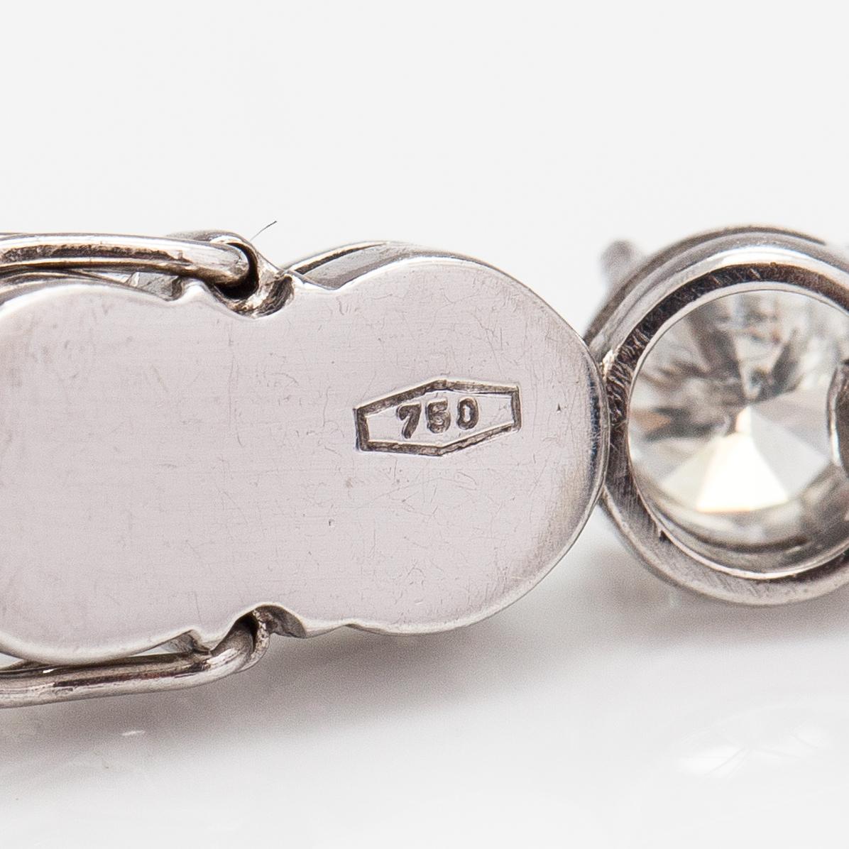 Tennisrannekoru, 18K valkokultaa ja briljanttihiottuja timantteja n. 7.50 ct yht.