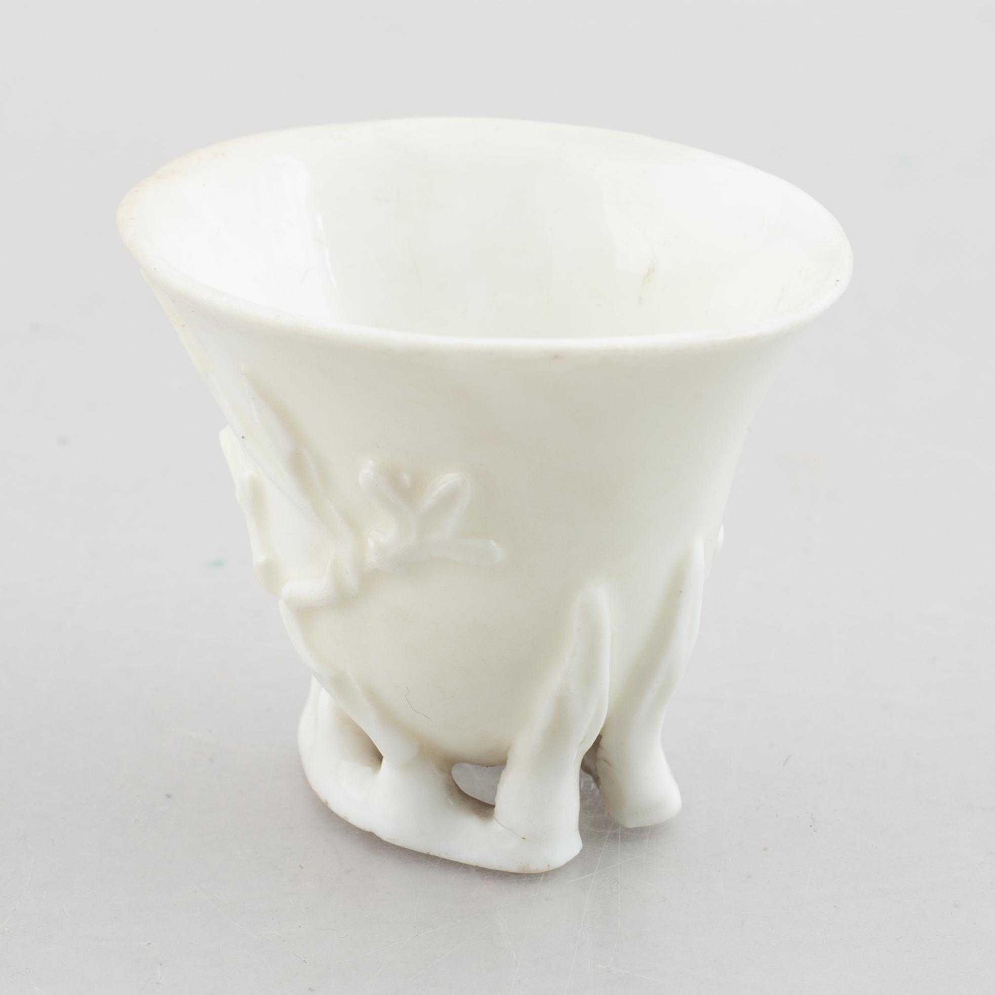 A blanc de chine rhinoceros libation cup, Qing dynasty, 18th century.