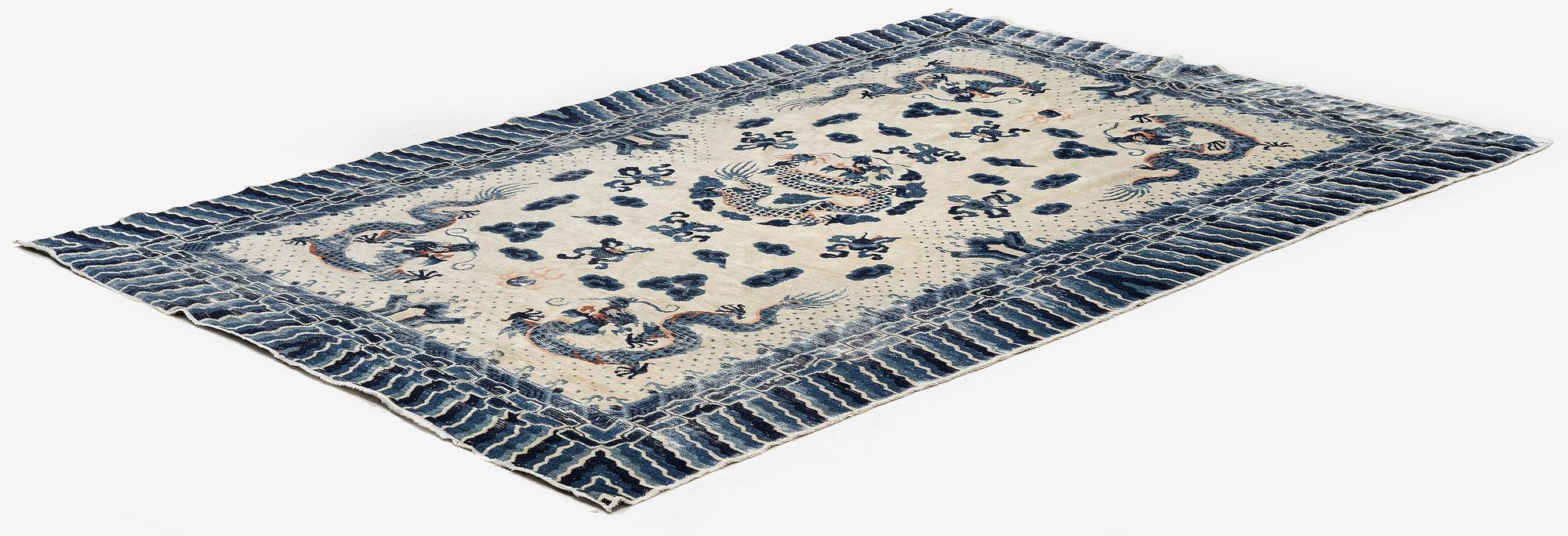 An antique Chinese ' five dragon rug', c. 280 x 190 cm.