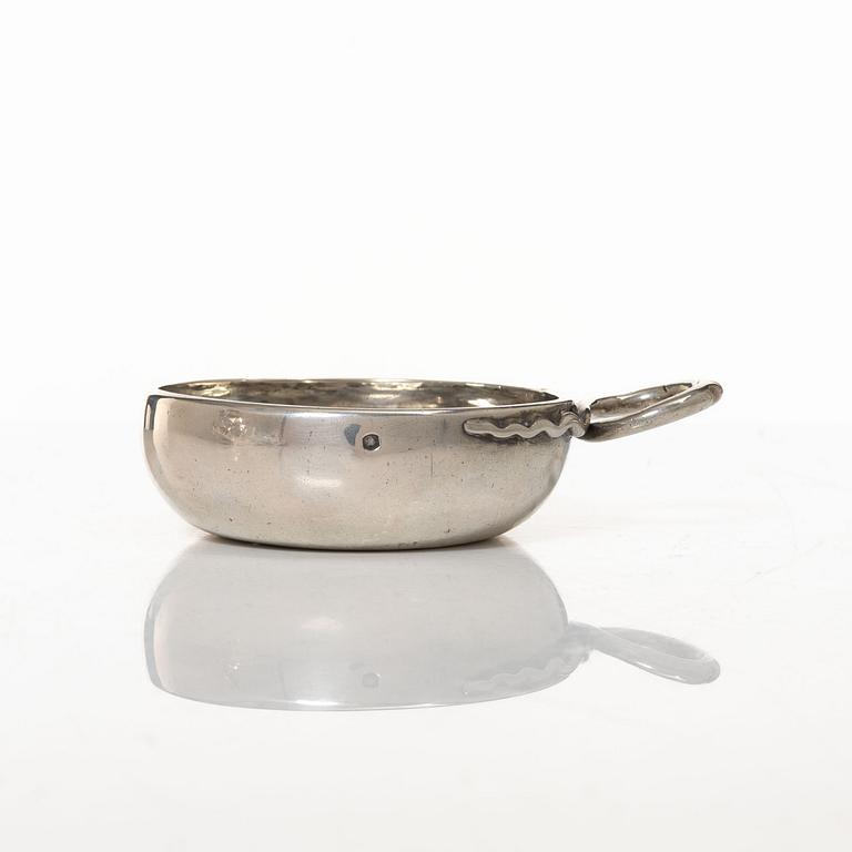 A French silver tastevin, mid-19th Century.