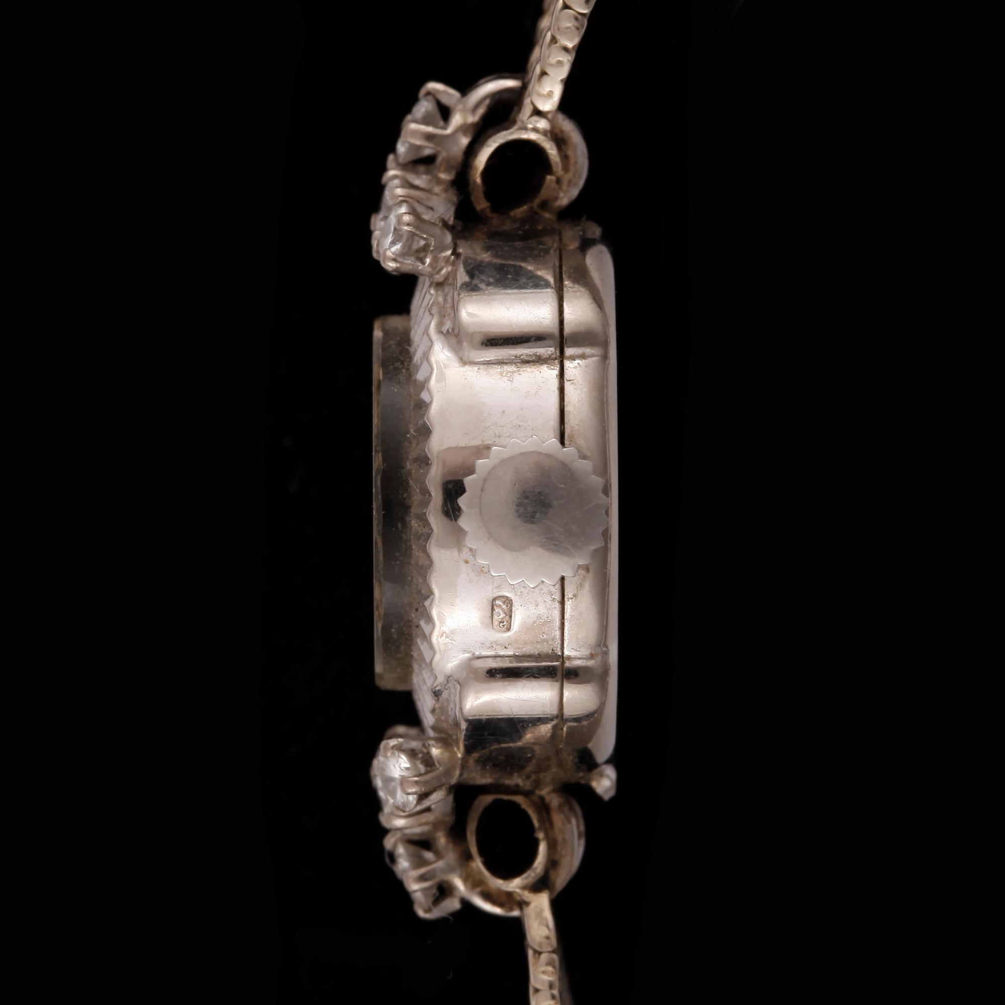 ARMBANDSUR, 18k vitguld med 10 briljantslipade diamanter, tot ca 0,3ct. "Gübelin". Total guldvikt ca 19 gram.