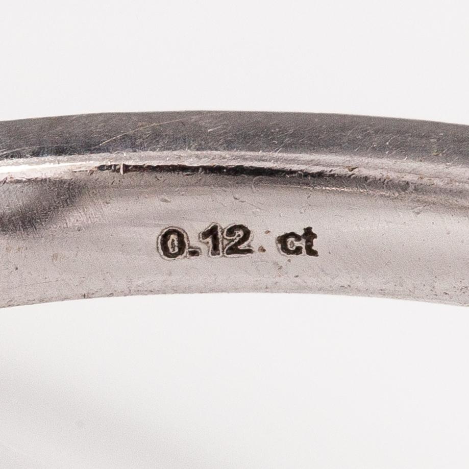 A 14K white gold ring with a topaz and diamonds ca. 0.12 ct in total. Faber art, Helsinki.