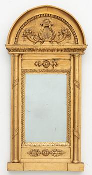 An Empire mirror, early 19th Century.