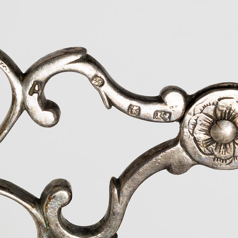 A pair of Swedish silver sugar tongs, mark of Isak Sauter, Stockholm, 1759. Rococo.