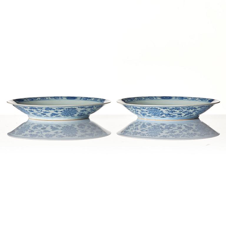 A pair of blue and white lotus dishes, Qing dynasty, Qianlong seal mark and of the period (1736-95).