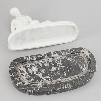 A parian figurine, 'the dying gaul', after an antique sculpture. 20th century.