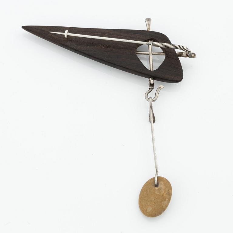 Vivianna Torun Bülow-Hübe, a wooden and silver brooch, executed in her own workshop, circa 1950.