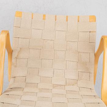 Bruno Mathsson, a pir of 'Eva' armchairs, Dux, late 20th century.