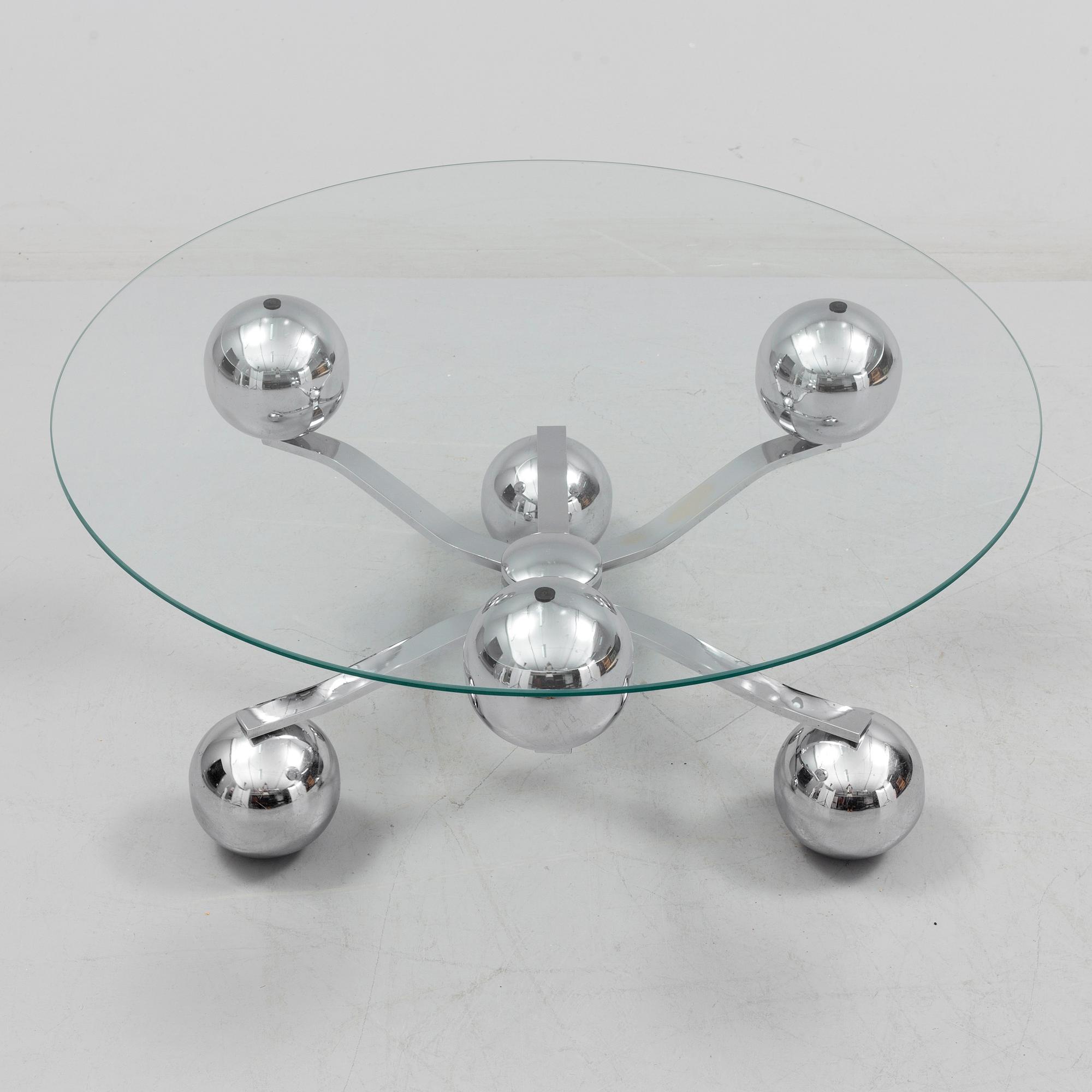 A 1960s / 70s coffee table with glass top.