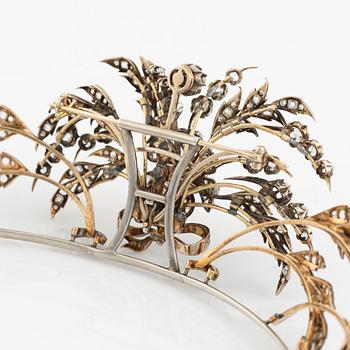 A brooch/tiara combination.