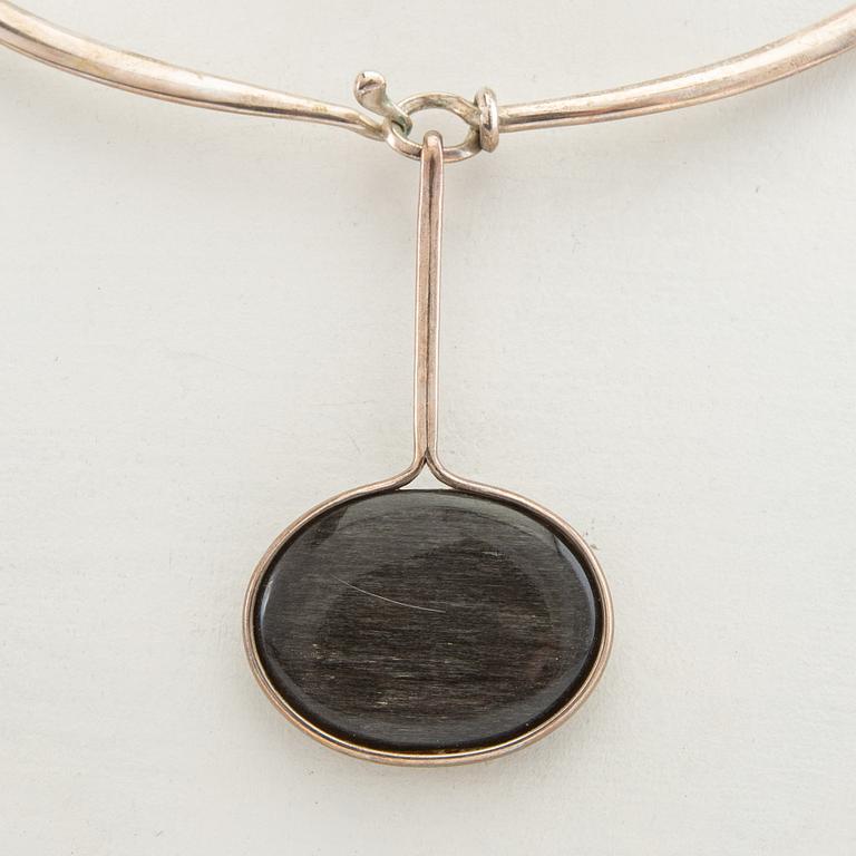 Vivianna Torun Bülow-Hübe, Necklace with pendant and a pair of earrings by Georg Jensen, Denmark, sterling silver and stone.