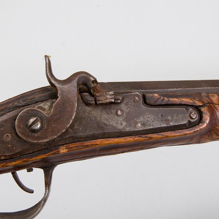 A percussion rifle marked Tula 1788.