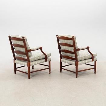 Arne Norell, a pair of Gripsholm model armchairs, later part of the 20th century.