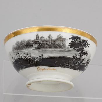 A group of seven cups, one with dish, Germany and France, 19th century.