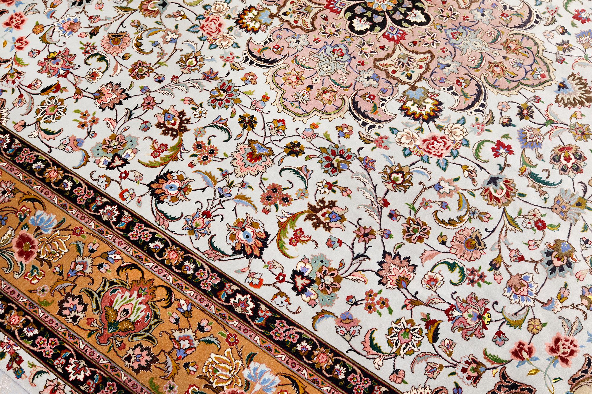 A part silk Tabriz carpet, so-called 50 Raj, approx. 348 x 252 cm.