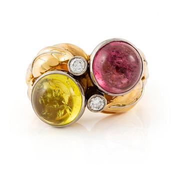 508. An 18K gold ring with cabochon-cut tourmalines.