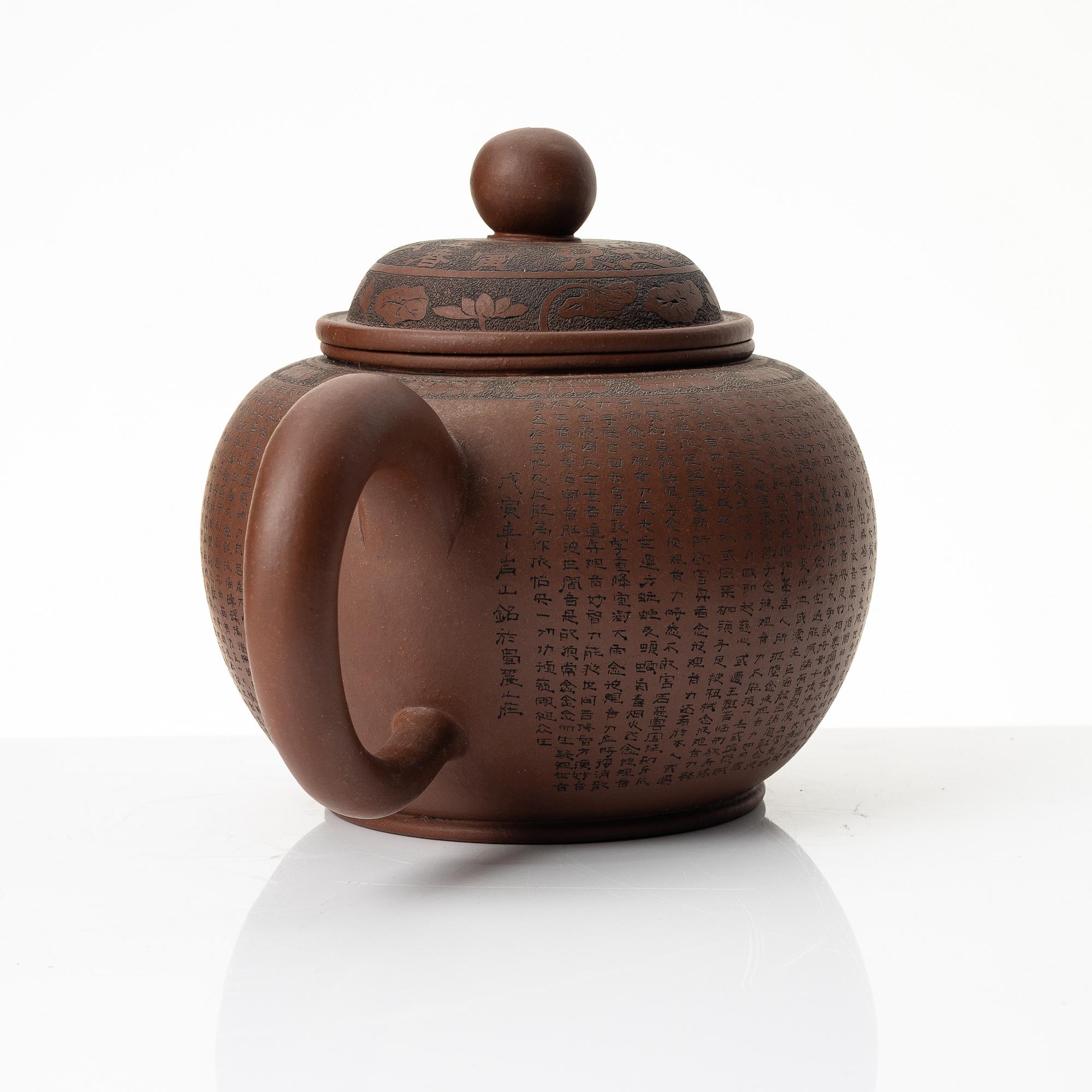 A 'calligraphy' yixing teapot, China, later part of the 1900s.