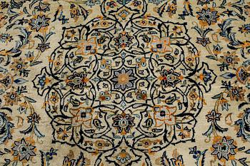 A Keshan rug, signed, ca 370 x 268 cm.